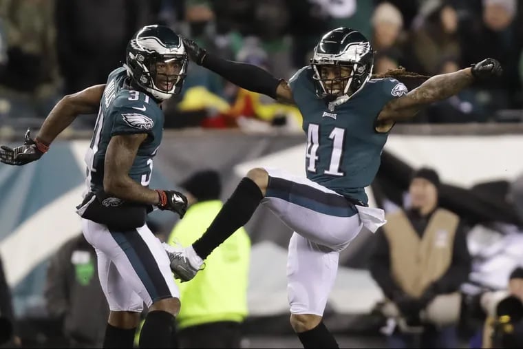 Eagles cornerback Ronald Darby (right) and cornerback Jalen Mills celebrate after a third-period stop against the Atlanta Falcons in a NFC Divisional Playoff game on Saturday, January 13, 2018 in Philadelphia. YONG KIM / Staff Photographer