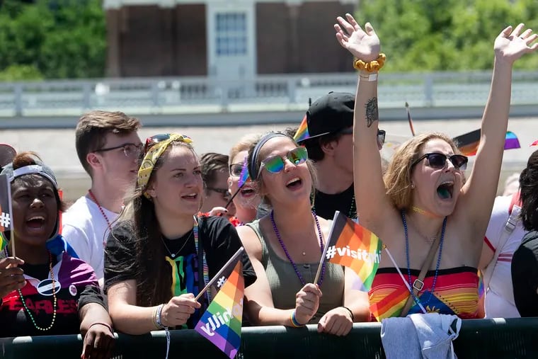 Parade-goers cheer during, Philly's LGBT Pride Parade in Philadelphia Pa.The parade theme was the ÒStonewall 50,Ó in honor of the 50th anniversary of the Stonewall riots and the beginning of the LGBT rights movement.