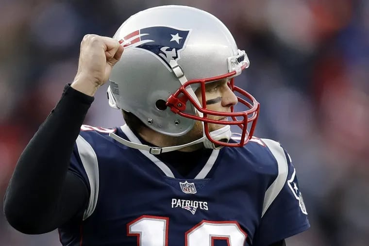 New England quarterback Tom Brady leads the NFL in passing yards and completions. (AP Photo/Charles Krupa)