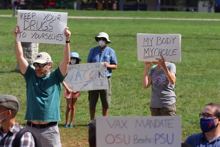 An anti-vaccination rally on Penn State's campus in State College in August. Unvaccinated people being treated for COVID-19 are primarily responsible for shortages of some medicines — including a drug required by the author.