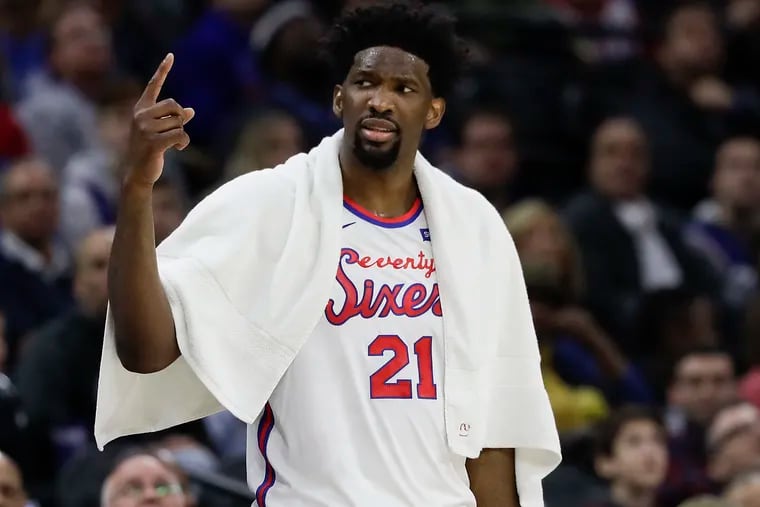 Sixers center Joel Embiid raises his finger after teammate guard Josh Richardson committed a foul against the Brooklyn Nets on Thursday, February 20, 2020 in Philadelphia.