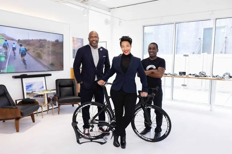 Whitney Thomas (left); his wife Kishawna Thomas (center) and partner Philip Greene (right) in their new store, Bikes by Design, in the Northern Liberties neighborhood.