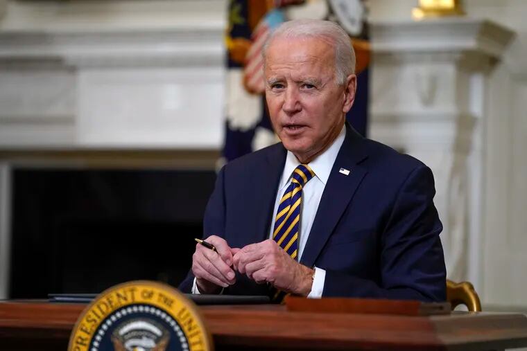 President Joe Biden pauses after signing an executive order relating to U.S. supply chains, in the State Dining Room of the White House in Washington.