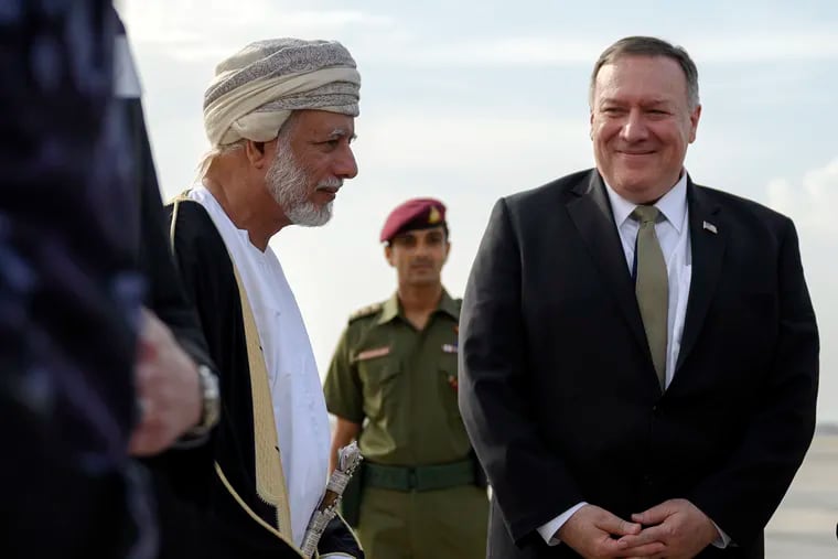 U.S. Secretary of State Mike Pompeo is greeted by Oman's Minister of Foreign Affairs Yusuf bin Alawi bin Abdullah, left, upon his arrival in the Oman capital of Muscat, Friday Feb. 21, 2020.