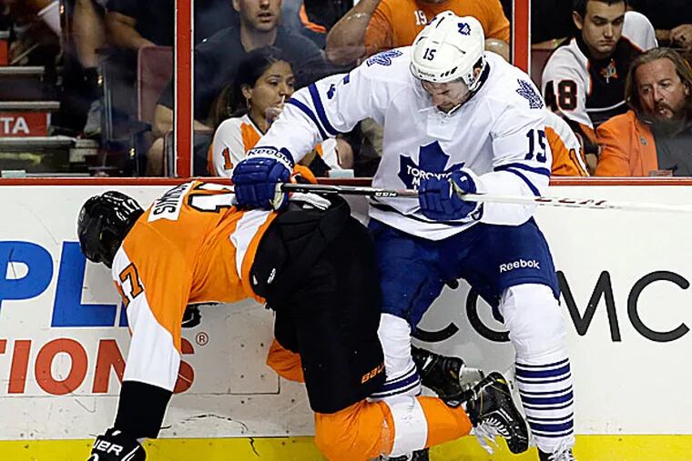The Maple Leafs' Paul Ranger shoves the Flyers' Wayne Simmonds during the second period. (Matt Slocum/AP)
