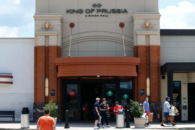 Shoppers enter and leave the King of Prussia Mall on Friday, June 26, 2020. The King of Prussia Mall reopened today, after a 10-week coronavirus shut down.