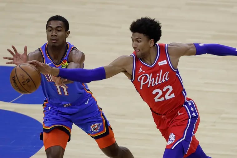 Sixers guard Matisse Thybulle steals the basketball against Oklahoma City Thunder guard Theo Maledon late in the second quarter on Monday, April 26, 2021.
