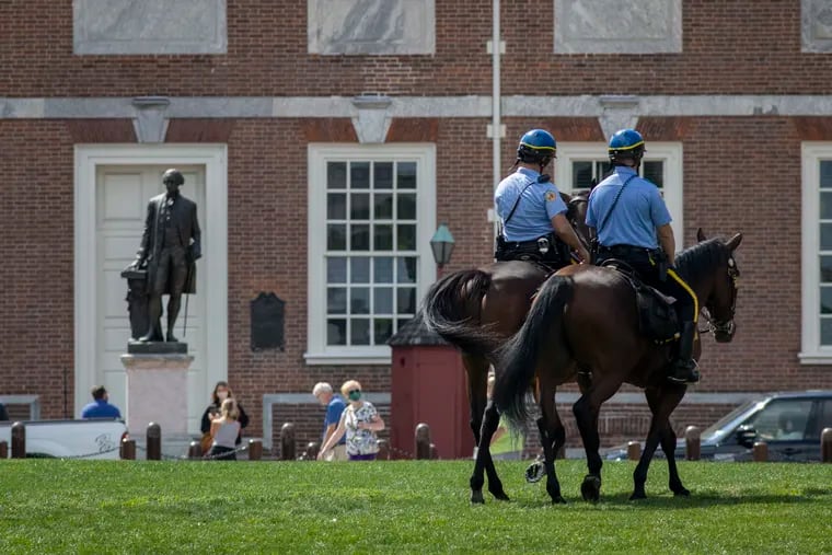 Philadelphia Mounted Police officers cross Independence Mall in the Old City section of Philadelphia on Friday, September 10, 2021. The mall is one of the areas that will be affected by a government shutdown.