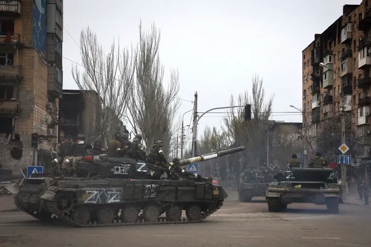 Russian military vehicles moving in an area controlled by Russian-backed separatist forces in Mariupol, Ukraine, on Saturday.