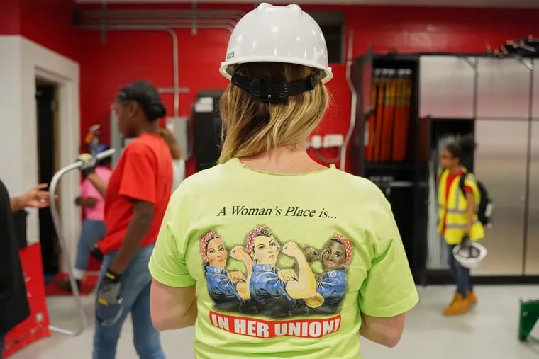 Erin O'Brien-Hofmann wears a shirt reading " A Women's Place is In Her Union" during the week long Mentoring Young Women In Construction summer camp at International Brotherhood Of Electrical Workers Local Union 98 in Philadelphia, PA on Wednesday, June 26, 2019.