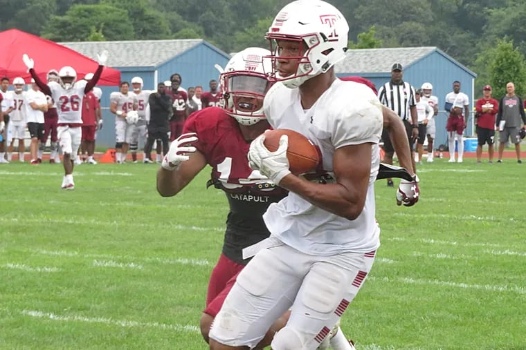 Temple WR Branden Mack heads to the end zone to complete a long scoring pass and end the Owls scrimmage.