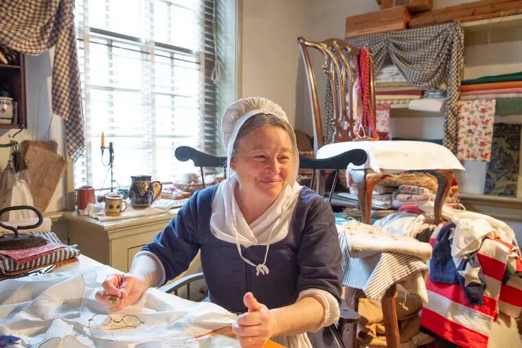 Carol Spacht who portrays Betsy Ross at the Betsy Ross House, in the house's sew room.