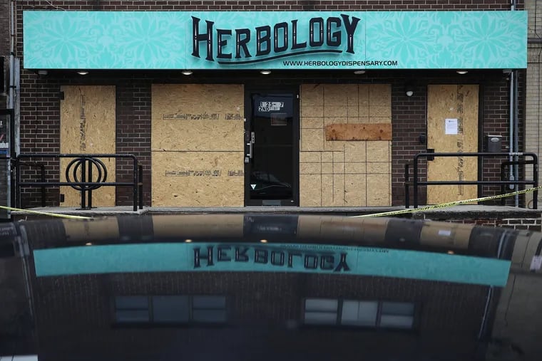 The boarded up Herbology medical marijuana dispensary in South Philadelphia. The store was recently vandalized.