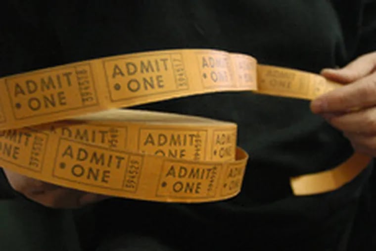 Bob Langmuir holds a roll of tickets to Hubert&#0039;s Dime Museum.