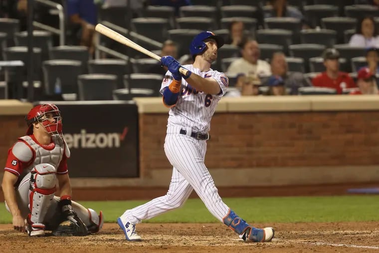 The New York Mets' Jeff McNeil hits a home run during the seventh inning against the Phillies.