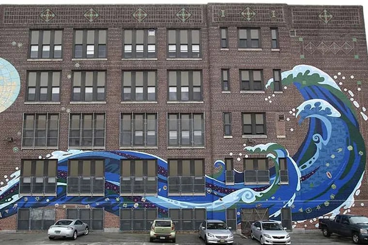 Katsushika Hokusai's "Great Wave" on Bodine High School for International Affairs, which is international again thanks to $100,000 raised by readers after the school severed ties with the World Affairs Council of Philadelphia due to the Philadelphia School District's budget crisis.