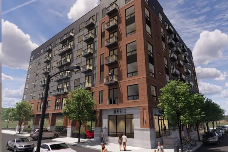 Looking southeast from Girard Avenue at the new 84-unit apartment building proposed by Hightop Real Estate & Development that will replace a bank.