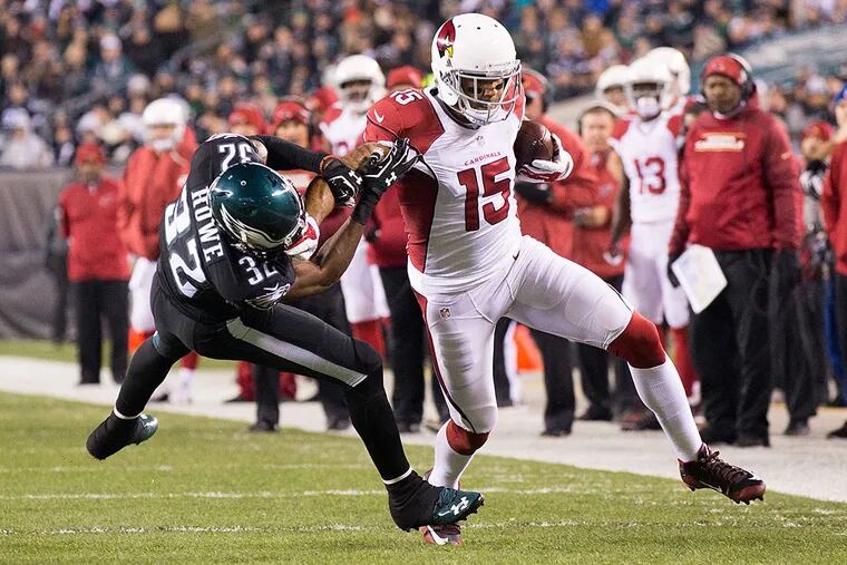 Arizona Cardinals wide receiver Michael Floyd (15) makes a reception past Philadelphia Eagles cornerback Eric Rowe (32) during the first half at Lincoln Financial Field.