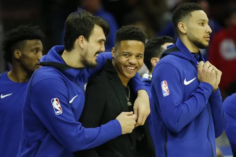 Sixers guard Markelle Fultz smiles with teammate forward Dario Saric and guard Ben Simmons late in the fourth-quarter against the Detroit Pistons on Friday, Jan. 5, 2018 in Philadelphia.