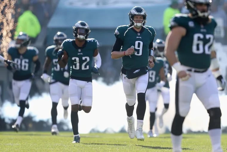 Eagles tight end Zach Ertz (left), cornerback Rasul Douglas (second from left), quarterback Nick Foles (center) and center Jason Kelce (right) have played well during the team's 4-1 stretch run.
