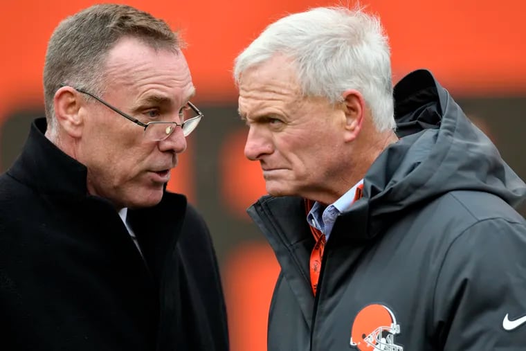 Former Cleveland Browns general manager John Dorsey (left) talks with owner Jimmy Haslam in 2017.