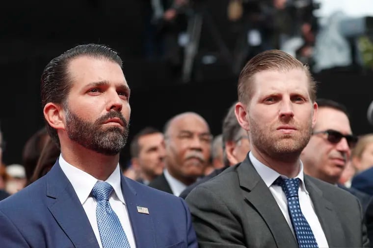 Donald Trump Jr. (left) and Eric Trump attend a ceremony to mark the 75th anniversary of D-Day at the Normandy American Cemetery in Colleville-sur-Mer, Normandy, France, Thursday, June 6, 2019.