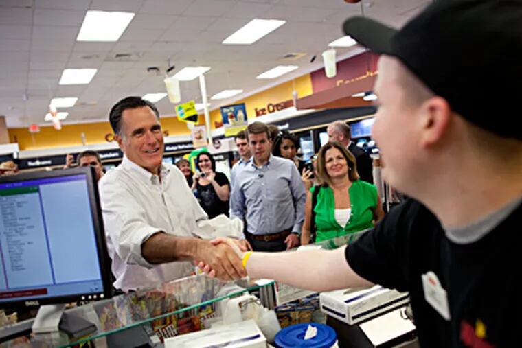 Mitt Romney shakes hands and orders a sandwich at a Quakertown Wawa. The candidate's small-town bus tour brought him to Bucks County, but the presence of 250 protesters at his scheduled stop chased him to a different store. EVAN VUCCI / AP