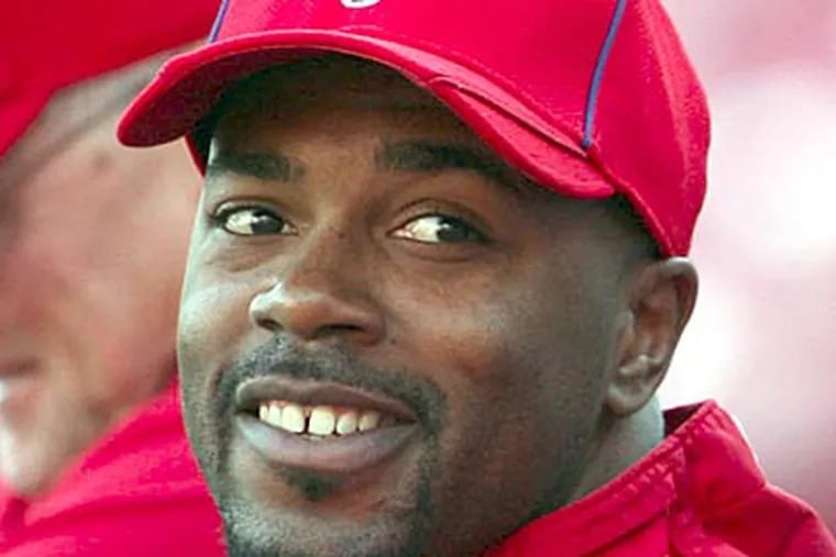 Jimmy Rollins will remain with the Phillies for at least three more seasons. (Yong Kim/Staff file photo)