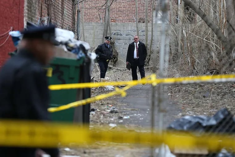 DAVID MAIALETTI / STAFF PHOTOGRAPHER A man questioned in the burial of a woman's body Tuesday in a Frankford yard has a violent past, police sources said yesterday.
