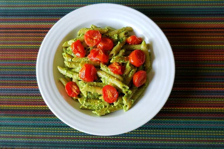 Peruvian pesto with penne and roasted tomatoes.