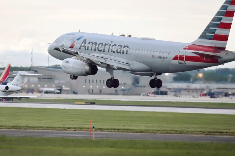 An American Airlines plane lands at Philadelphia International Airport on July 18, 2019.