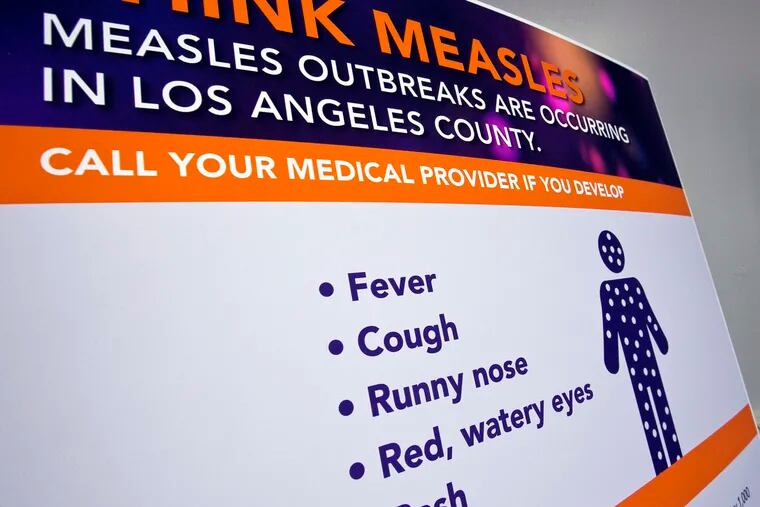 A poster released by Los Angeles County Department of Public Health is seen as experts answer questions regarding the spread of measles in the United States, where cases have reached a 25-year high. (AP Photo/Damian Dovarganes)