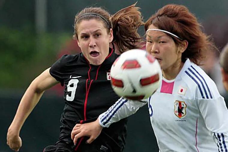 Heather O'Reilly (left) scored one of the two goals in the U.S.' 2-0 win over Japan. (Gerry Broome/AP)