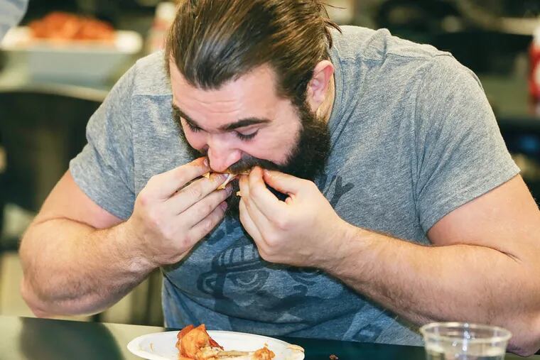 5 wings in two minutes Eagles center Jason Kelce qualifies for WIP's Wing Bowl 22 at the NovaCare Complex, Tuesday, January 28, 2014. 51 seconds to eat them.  (  Steven M. Falk / Staff Photographer )