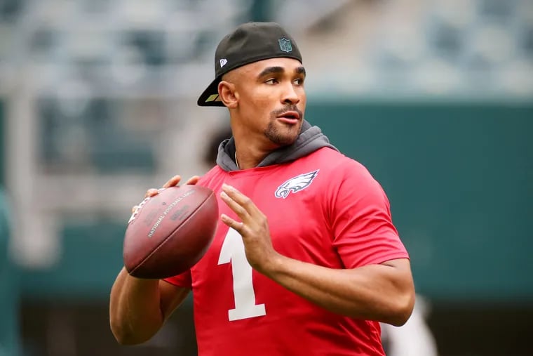 Eagles quarterback Jalen Hurts warming up during practice at Lincoln Financial Field on June 4.
