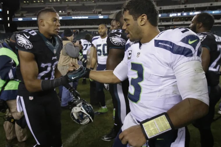 Cary Williams and Russell Wilson are teammates now. (Associated Press)