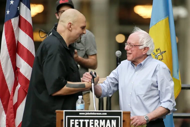Lt. Gov. John Fetterman (left) welcomes Sen. Bernie Sanders during a 2018 rally when Fetterman was running for lieutenant governor.