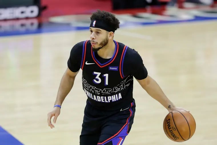 Sixers guard Seth Curry dribbles the basketball against the Cleveland Cavaliers on Saturday, February 27, 2021 in Philadelphia.