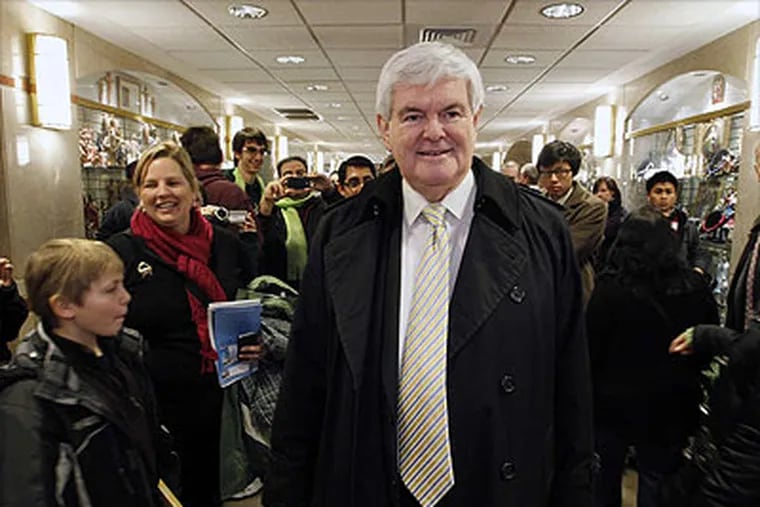 Presidential candidate Newt Gingrich is greeted by supporters after Mass at the Basilica of the National Shrine in Washington after his surprising, 12-point victory in South Carolina. (Jose Luis Magana / Associated Press)