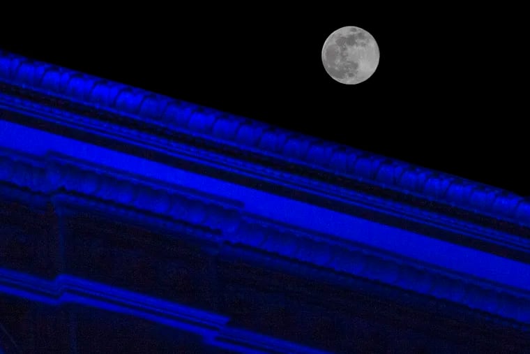 No, that's not a blue moon. Actually, it's the Super Pink Moon - the biggest full moon of 2020 - rising over the illuminated Lits Building on East Market Street as the city honored healthcare workers in April. The Halloween full moon will be blue in name only.