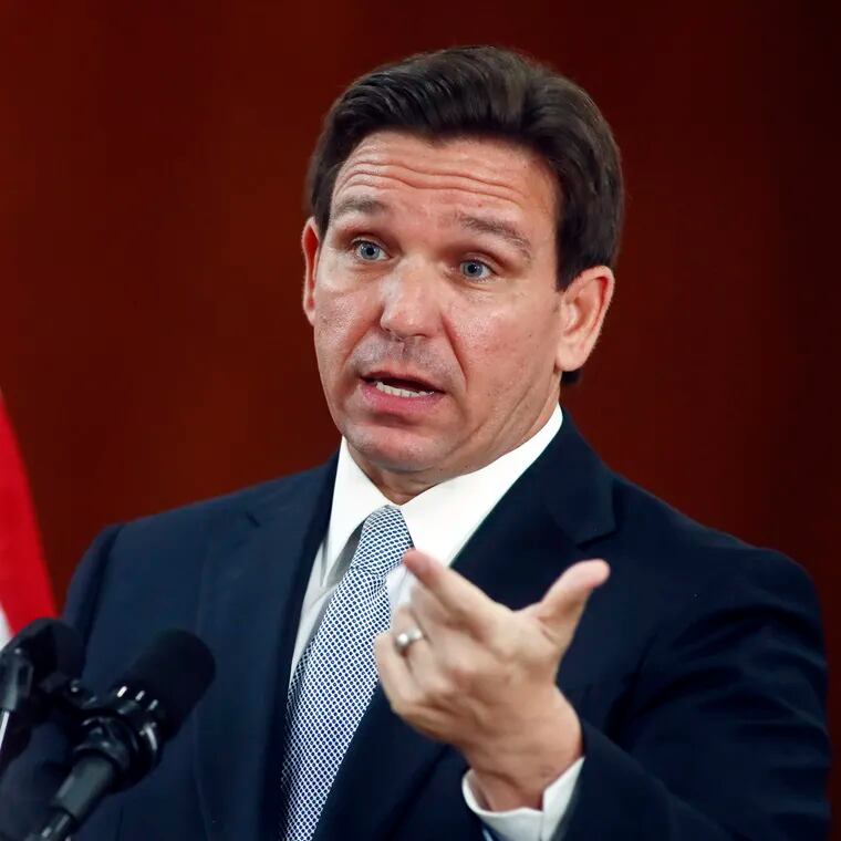 Florida Gov. Ron DeSantis answers questions from the media earlier this month at the state Capitol in Tallahassee, Fla.