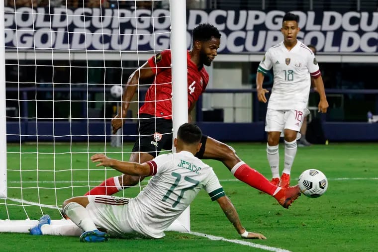 Trinidad and Tobago upset Jesús "Tecatito" Corona, center, and star-studded Mexico with a scoreless tie in the Gold Cup's opening game.