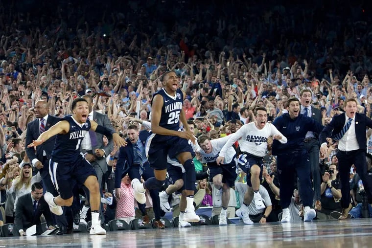The Villanova bench storms the court after Kris Jenkins hit the game-winning shot as time expired to defeat North Carolina and win the NCAA Men's Basketball Championship at NRG Stadium in Houston on April 4, 2016.