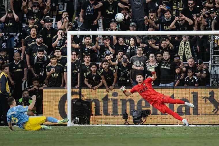 Los Angeles FC goalkeeper John McCarthy (right) looks on as the Union's Dániel Gazdag slips and shoots over the crossbar during the penalty kick shootout.