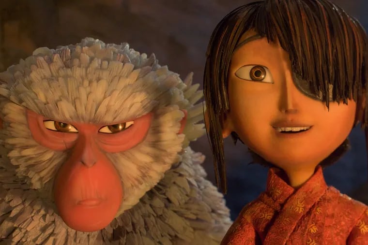 The boy Kubo (voiced by Art Parkinson) and bossy, opinionated Monkey (Charlize Theron).