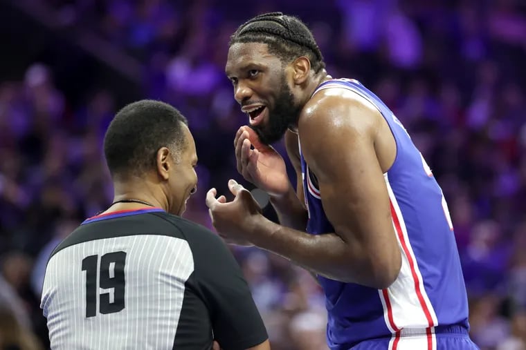 Joel Embiid of the Sixers jokes with official James Capers during a break in their game against the Pistons at the Wells Fargo Center on Jan. 10.