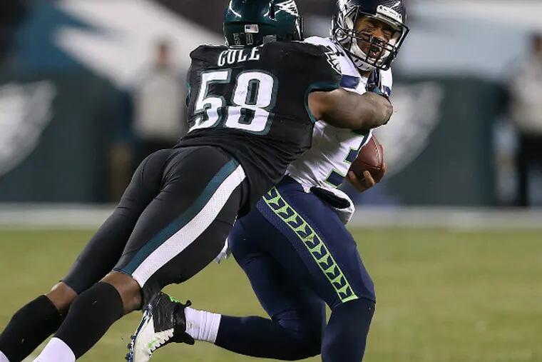 Eagles' Trent Cole Seahawks' Russell Wilson during the fourth  quarter.