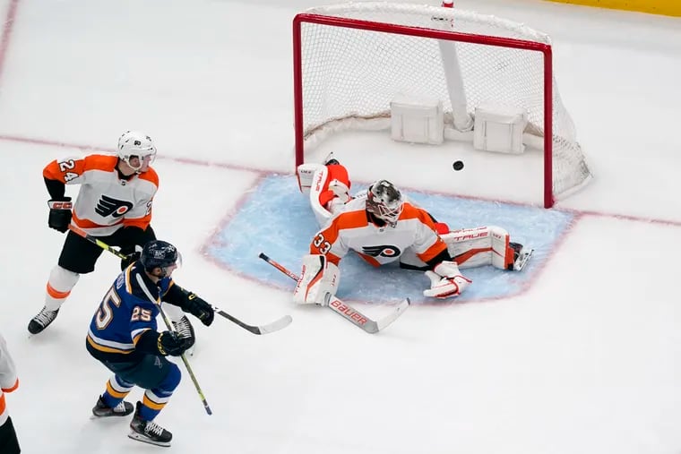 St. Louis Blues' Jordan Kyrou (25) celebrates after scoring the first goal of the game past Flyers goaltender Sam Ersson.