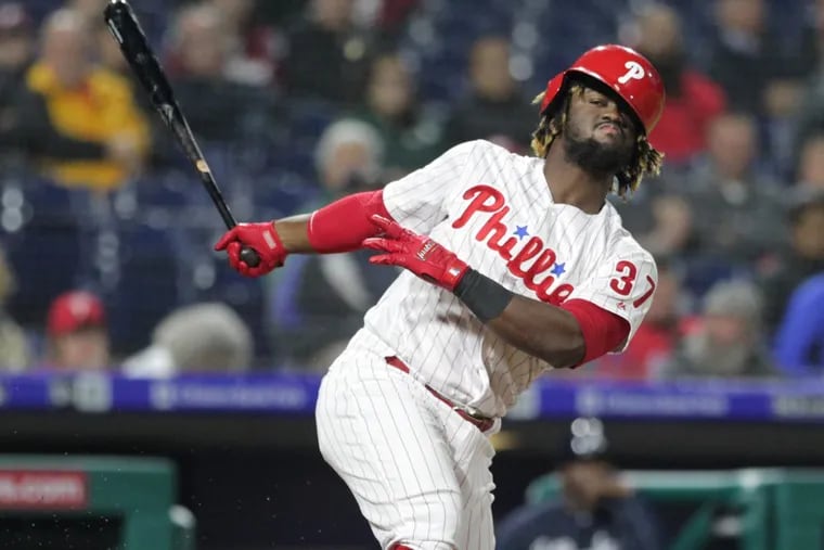 Phillies outfielder Odubel Herrera loses his helmet after striking out during the Phillies’ 3-1 loss to the Braves on Tuesday.