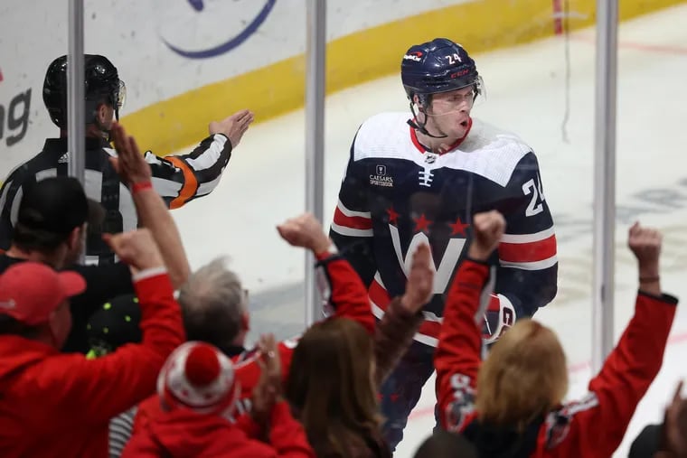 Connor McMichael #24 of the Washington Capitals celebrates after scoring a goal against the New Jersey Devils during the first period at Capital One Arena on February 20, 2024 in Washington, DC.